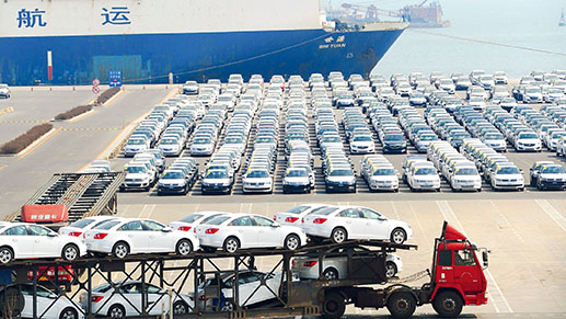 Lorries transporting new cars to the cargo terminal in Dalian, Liaoning Province