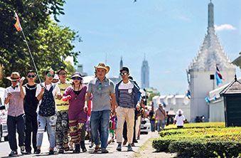 Tourists outside the Grand Palace in Bangkok, Thailand