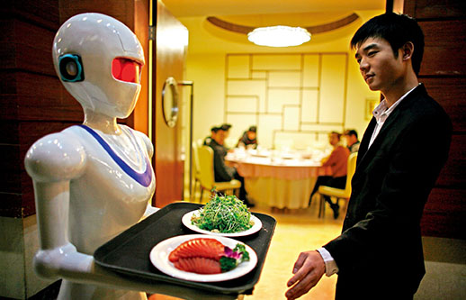 Yueyue, a robot, serving customers in a restaurant in Tianjin, drawing a lot of curious attention