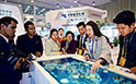 The Myanmar media delegation visits an exhibition for State-owned enterprises’ achievements in Beijing.