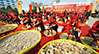 Performance of the traditional technique of manual cutting of medicinal herbs.