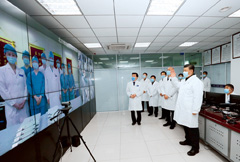 Chinese President Xi Jinping talks to medical staff on duty via a video link at the monitoring center at Beijing Ditan Hospital in Beijing on February 10.