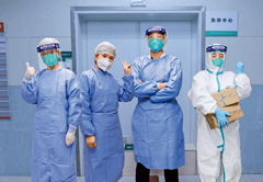 Bai Hui, Li Chunfang, Zhao Zhigang and Guo Qin (left to right), doctors and nurses who have recovered from COVID-19 infection, return to work at the emergency center of Zhongnan Hospital of Wuhan University on February 6.
