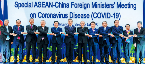 The Special ASEAN-China Foreign Ministers' Meeting on Coronavirus Disease (COVID-19) was held on February 20 in Vientiane, Laos. Before the meeting, foreign ministers linked arms as they cheered for Wuhan, the main battlefield against the epidemic.