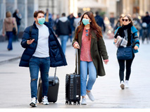 People wearing masks on the street of Milan, Italy, February 24.
