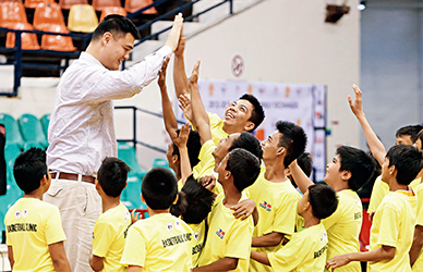 May 5, 2013: Former NBA star Yao Ming greets young basketball players during a visit to Manila. For two days, Yao’s Shanghai Sharks played exhibition games against Philippine basketball teams.