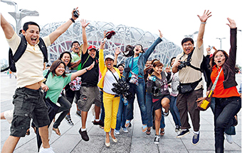 September 7, 2008: Spectators from the Philippines pose in front of the National Stadium (“Bird’s Nest”) in Beijing, the main stadium of 2008 Olympic Games.