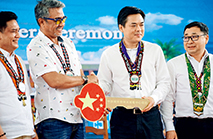 Governor Adolph Edward Plaza (second left) of Agusan del Sur province receives a symbolic key to the rehab center from Jin Yuan (second right), Economic and Commercial Counsellor of the Chinese Embassy in the Philippines.