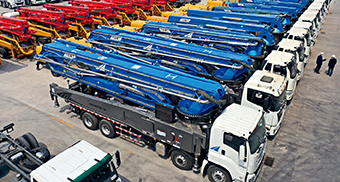 Finished concrete pump trucks in the Automobile Industry New Town in Qingdao, Shandong Province, ready for overseas markets on April 7, 2020. (LIANG XIAOPENG)
