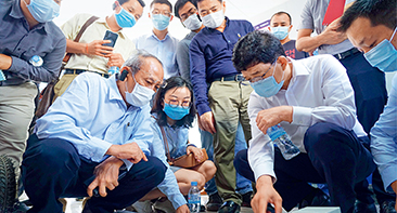 A top official from the Cambodian Ministry of Public Works and Transport (first left) visits the central laboratory of the Phnom Penh-Sihanoukville expressway in Kampong Speu, Cambodia, on June 12, 2020. (XINHUA)