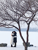 During the COVID-19 outbreak, a couple wearing masks hugs in Summer Palace Park, Beijing, China. (JIANG YONGGANG)