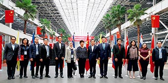 The delegation members pose for a group photo at Sany Industrial Park in Changsha.
